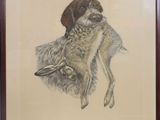 tableau représentant un chien tenant un oiseau dans sa gueule, dans un cadre marron
