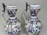 two vases sitting side by side on a table