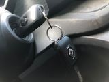 a car key in the center of a car ' s steering wheel