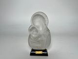 an image of a glass figurine of a woman on a black base