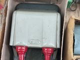a box that has two red and white valves in it