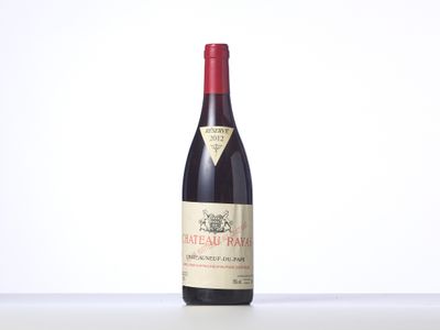 a bottle of red wine sitting on top of a table