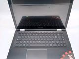 a laptop with a keyboard on it sitting on a table