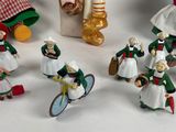 many figurines of people dressed in traditional clothing