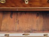 a wooden box with a drawer on top of it