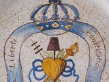 a plate with a picture of a heart and a crown on it