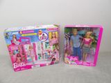 two barbie dolls in a box and a barbie doll in a box