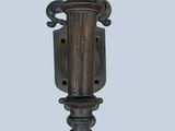 a large metal light that is hanging from the wall