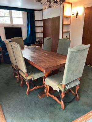 a dining room with a table and chairs in it