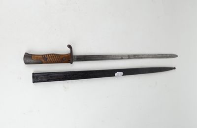 two swords with a wooden handle on a white surface
