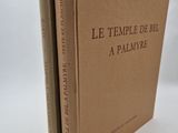 two books sitting on top of each other on a white surface