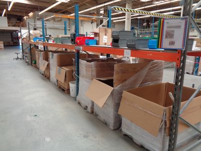 many boxes on the shelves in the warehouse