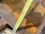 a measuring tape on the back of a piece of machinery
