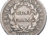 a close up of a coin with a wreath on it
