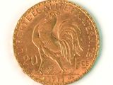 an image of a gold coin with a rooster on it