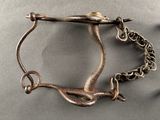a metal object with a chain attached to it