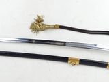 two swords on a white surface with a gold handle