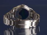 a close up of a watch on a table