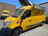 a yellow truck with a ladder on the back of it