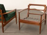 pair of mid century danish teak lounge chairs with green upholstered cushions