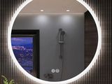 a bathroom with a sink and a mirror in it