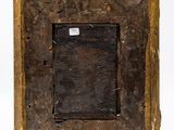 an old wooden picture frame on a white background with a sticker on it