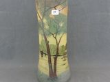 a vase with a picture of a tree on it