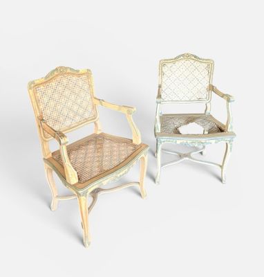 pair of antique painted chairs with cane back and cane arms