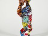 statue of a man with a skateboard in his hand