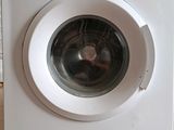 a washing machine that is sitting on the floor