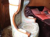 a chair that is sitting in the corner of a room