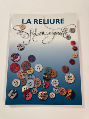 a close up of a book with buttons on it