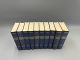 a set of six blue books on a white surface