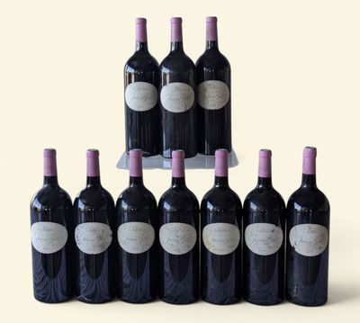 six bottles of red wine are lined up in a pyramid