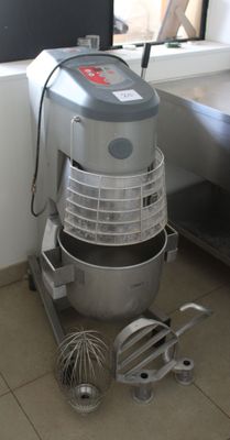 an image of a mixer in a kitchen with a window in the background