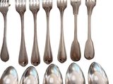 a lot of silver spoons and forks on a white background