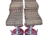 pair of wicker bar stools with chrome bases