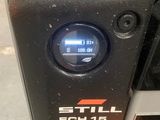 a close up of a car ' s engine with a clock on it