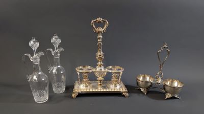 three pieces of silver and glass on a gray surface