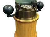 a wooden and metal device that is on a white background