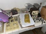 a desk with a lot of electronic equipment on it