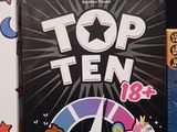 a box of top ten and a box of games on a table