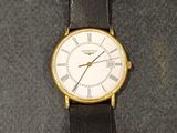 an image of a close up of a wrist watch on a table