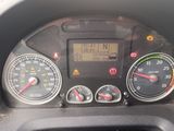 a close up of a car dashboard with various gauges