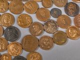 a lot of coins that are on the table