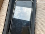 a box with a phone inside of it on a table