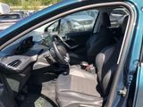 the interior of a car with the door open and the driver ' s seat down