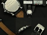 two watches and a caliper on a black surface