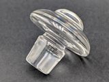 a close up of a clear glass knob on a black surface