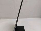 a black tablet computer sitting on a stand on a white surface